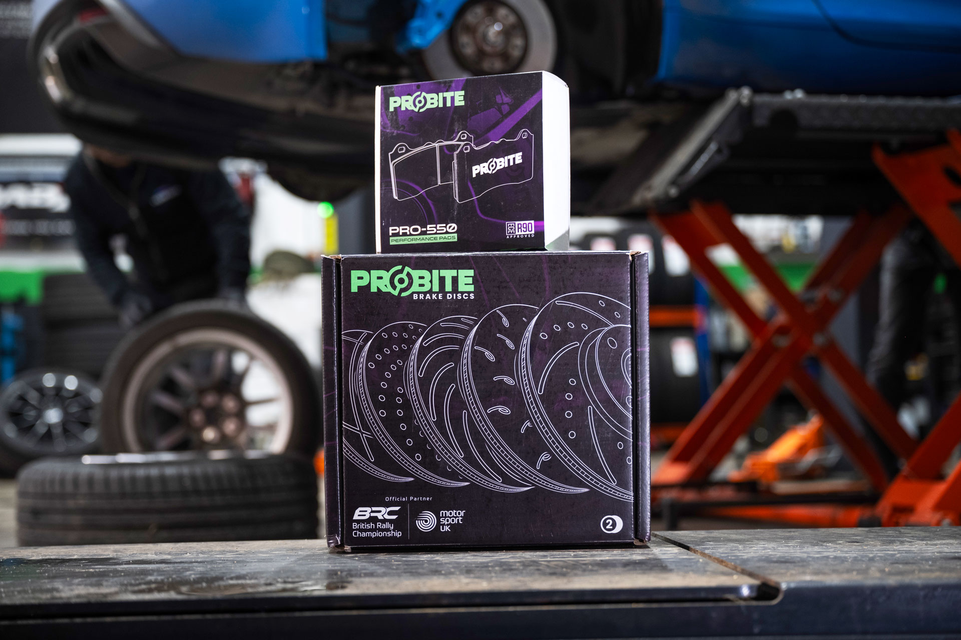 Probite discs and pads boxes in front of the Alpine A110 they're going to be fitted to.